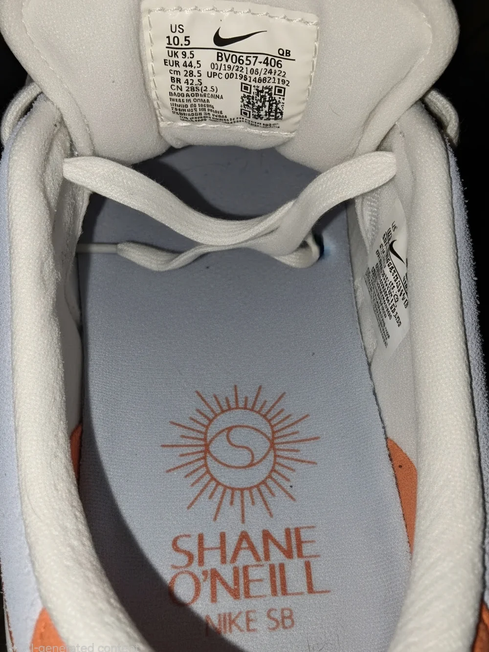 Nike Men’s Light Blue Sneakers with Orange Swoosh